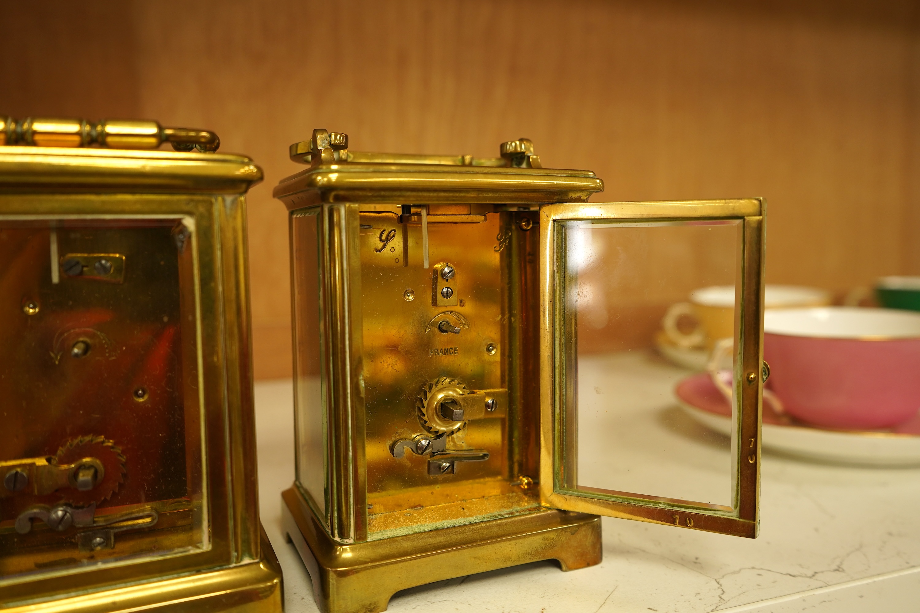 A lacquered brass champleve enamel carriage timepiece and one other, no keys, largest 15cm high